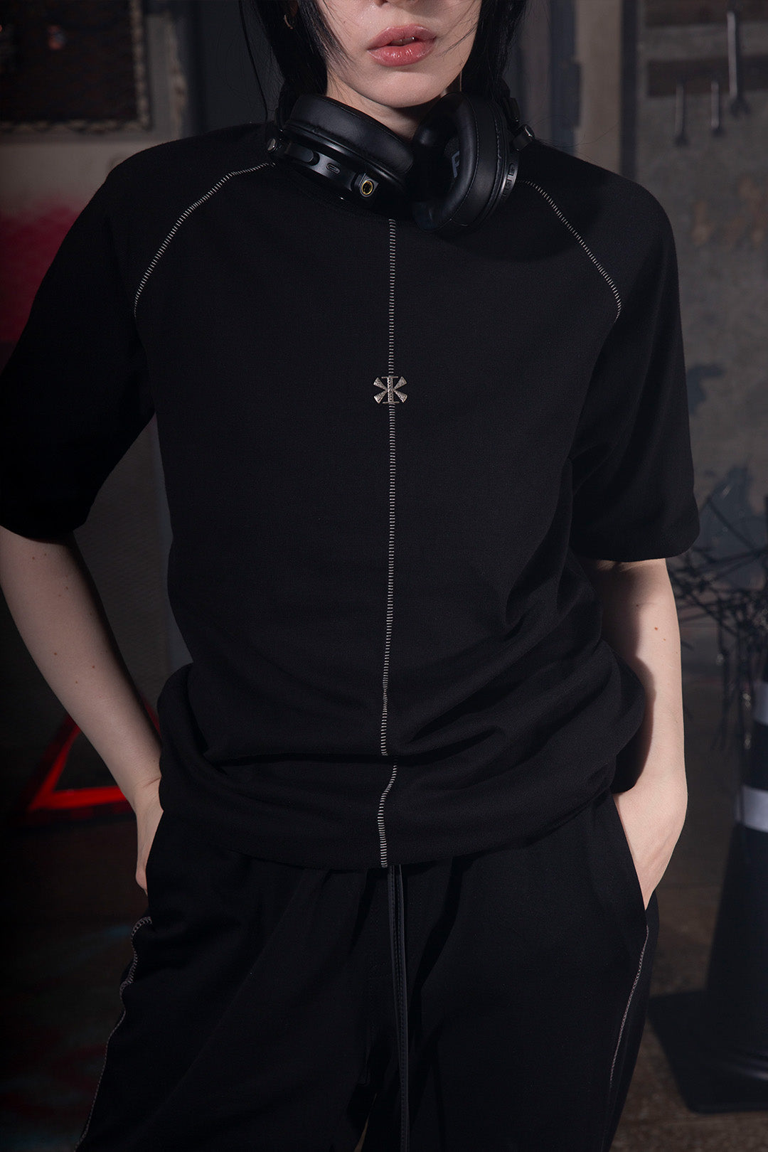 KIMMICK Creviced Bite black raglan half sleeve top showing textured fabric and relaxed fit on a mannequin.