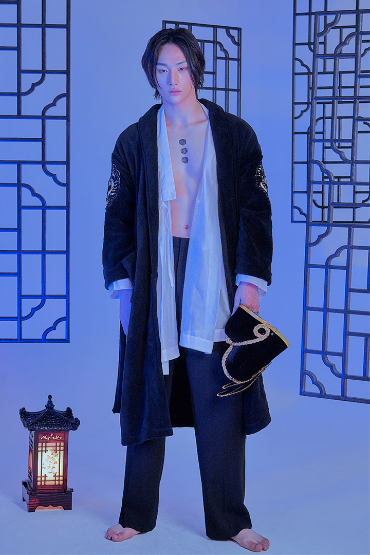 Black TM3 Royalty Sleepwear Gown displayed on a hanger, featuring a comfortable, flowing design ideal for sleepwear or lounge.