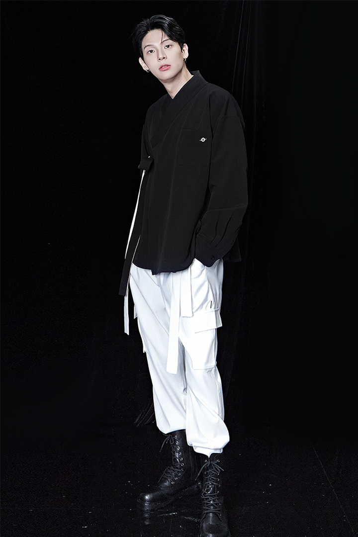 Black oversized shirt from TM3, casual fit with long sleeves and a relaxed style, displayed on a plain background.