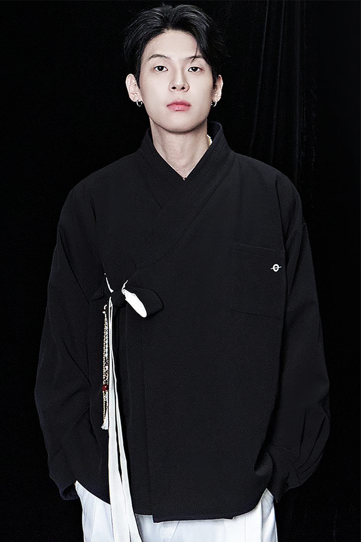Black oversized shirt from TM3, casual fit with long sleeves and a relaxed style, displayed on a plain background.