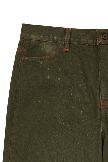 Laser-engraved pants from IOEDLE featuring unique strange landing design, shown in a close-up image highlighting the detailed pattern.