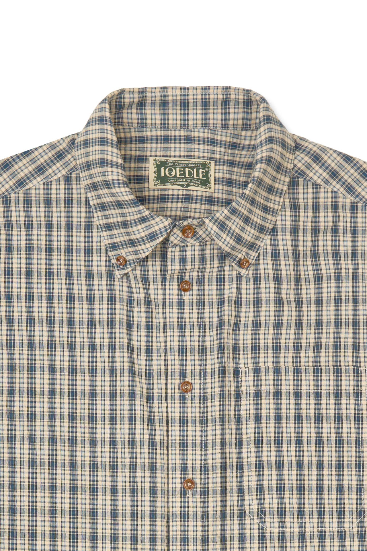IOEDLE Rocket Slit Short-sleeve Shirt displayed with a modern design and casual fit, featuring a relaxed collar and slit details.