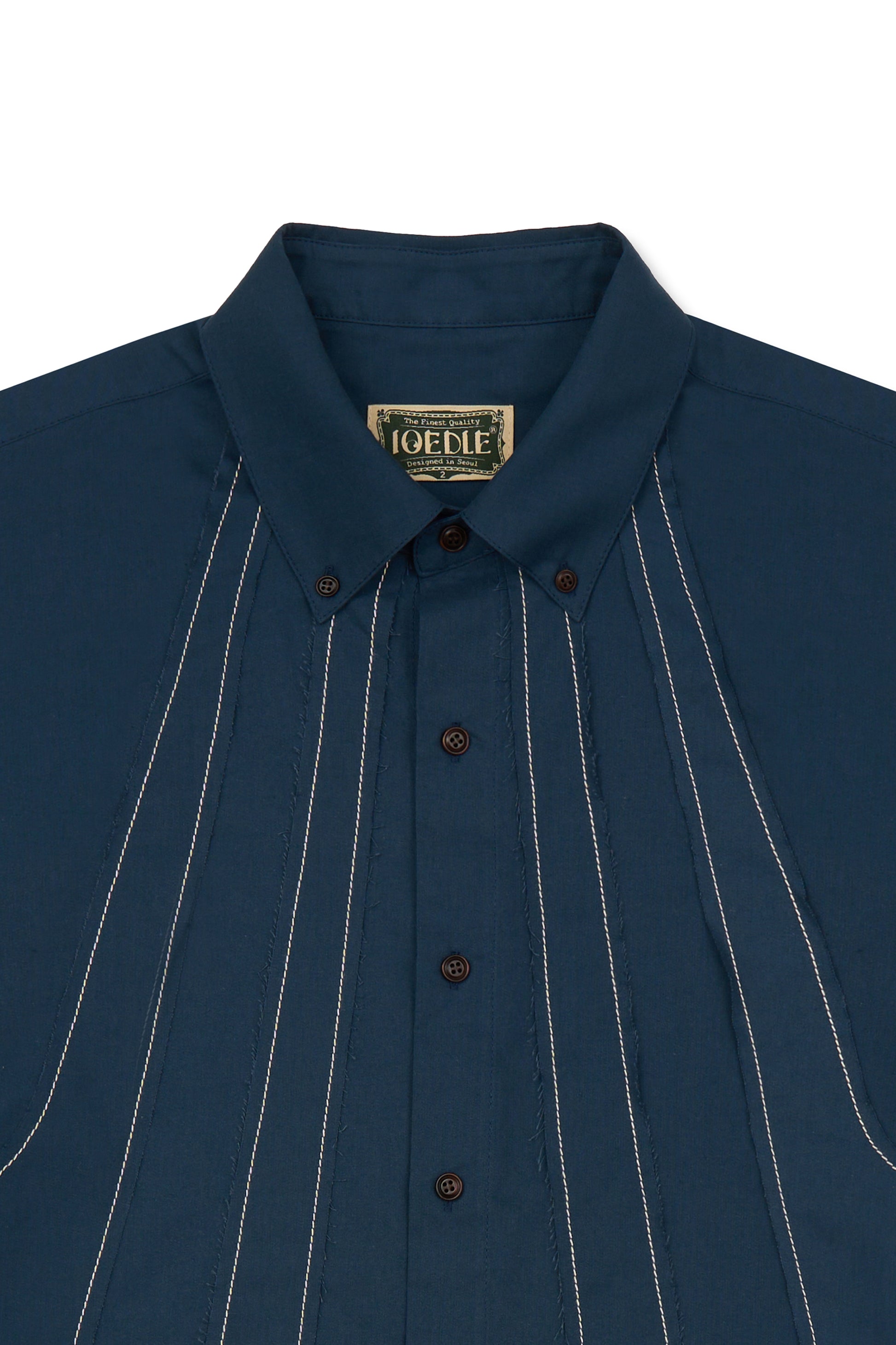 IOEDLE stitched stream short-sleeve shirt with detailed stitching and casual fit, displayed on a neutral background.