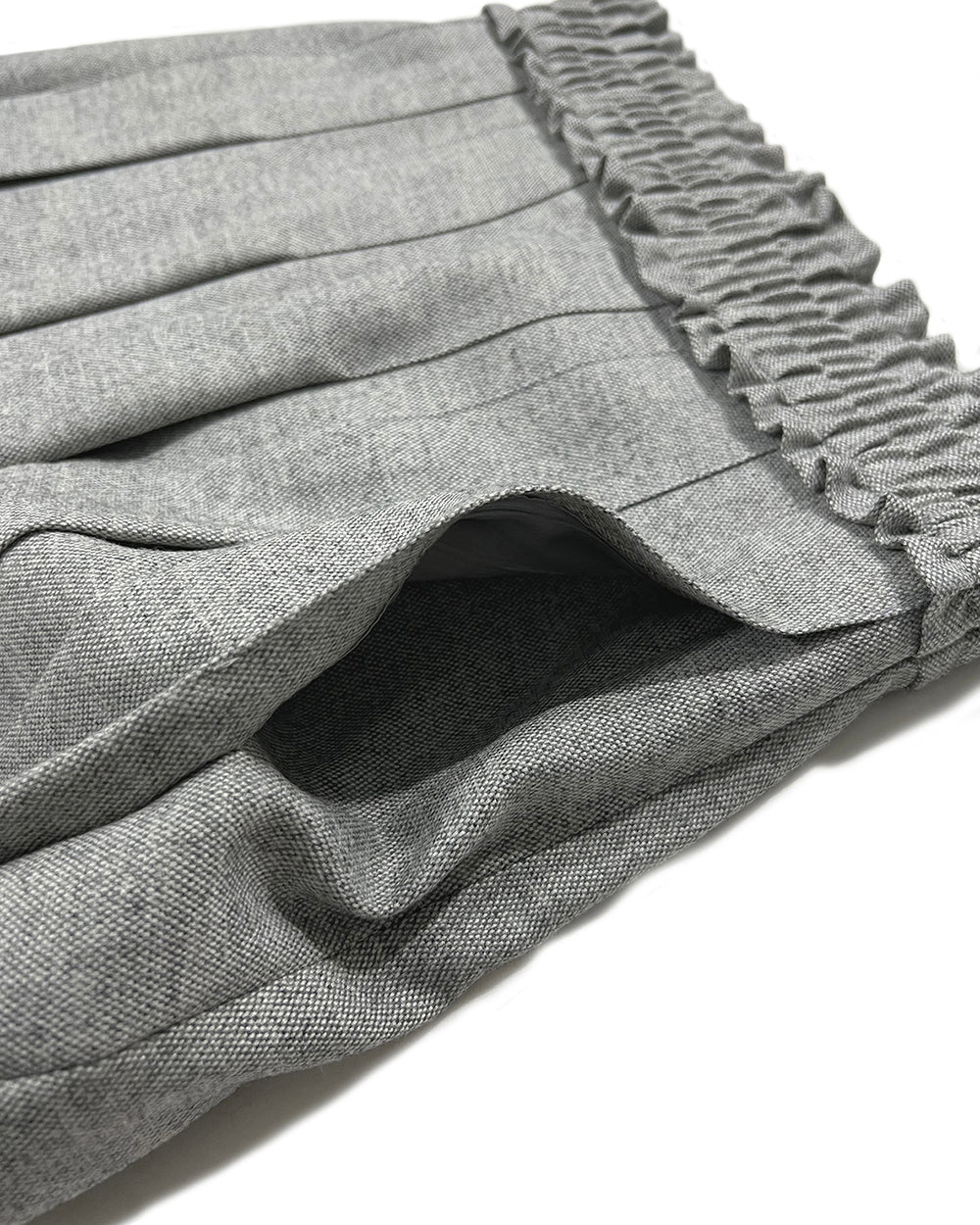 Love Crazy Wild Man frill pleats skirt in Melage Grey, showcasing flowing fabric and stylish design.