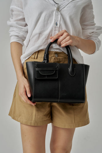 Black MIULIN 1st Anniversary Edition wallet bag showing sleek design with compact size and minimalist style.