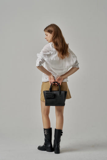 Black MIULIN 1st Anniversary Edition wallet bag showing sleek design with zipper closure and compact size.