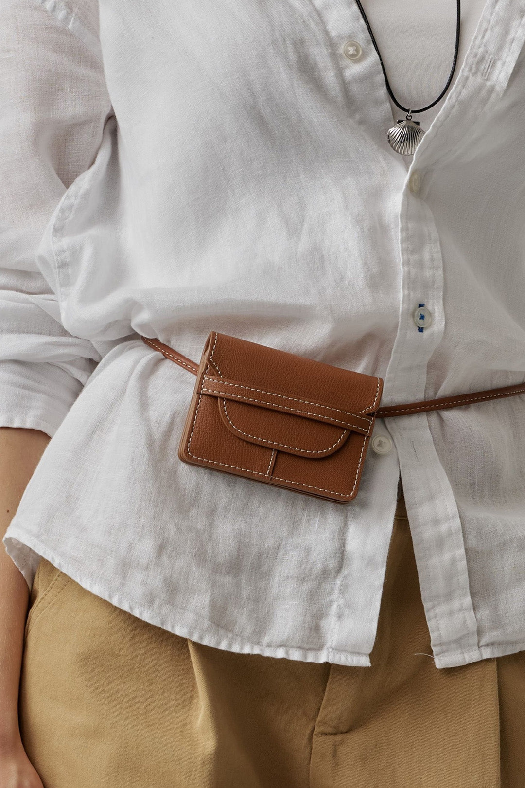 MIULIN 1st Anniversary Edition camel wallet bag showing sleek leather design and compact size.