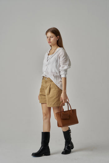 MIULIN 1st Anniversary Edition wallet bag in camel leather, featuring a compact design with a zip closure and stylish details.