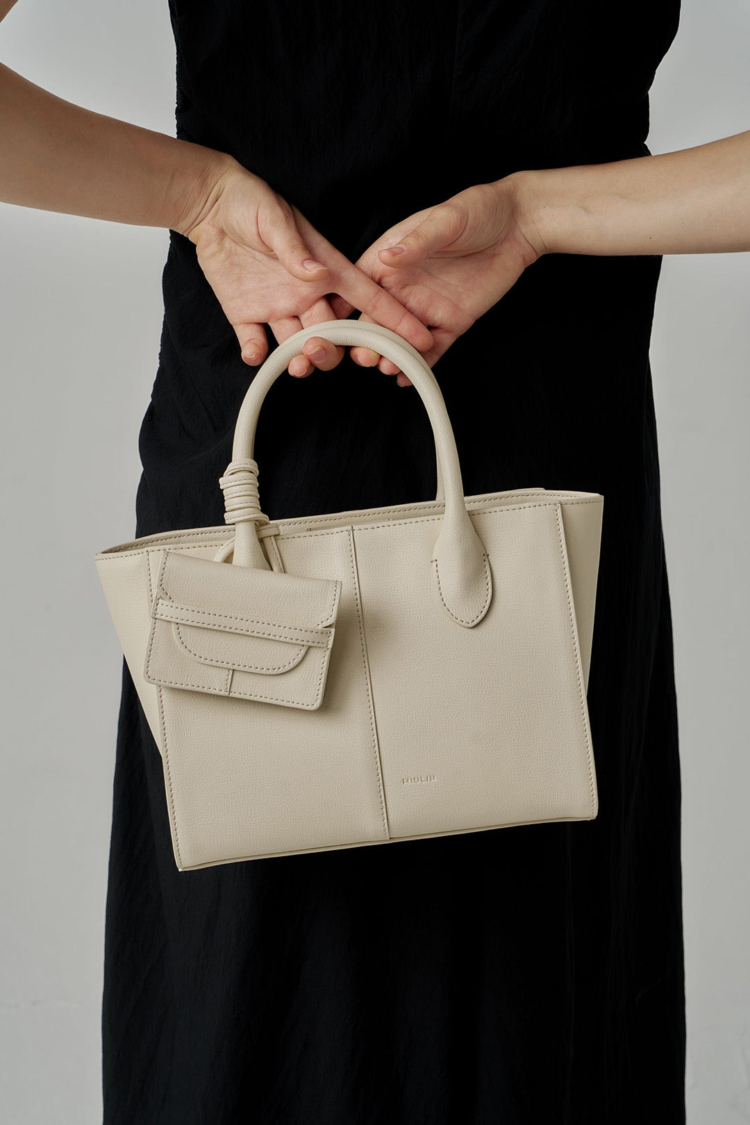 Ivory MIULIN 1st Anniversary Edition wallet bag with sleek design and compact size, perfect for everyday use.