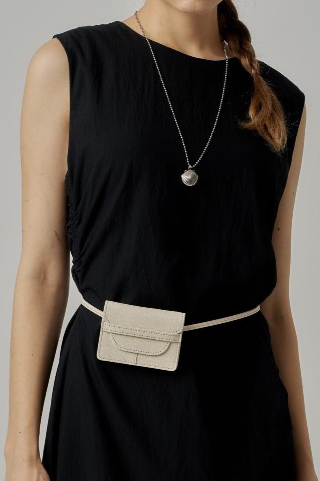 Ivory MIULIN 1st Anniversary Edition wallet bag with sleek design and compact size, ideal for carrying essentials.