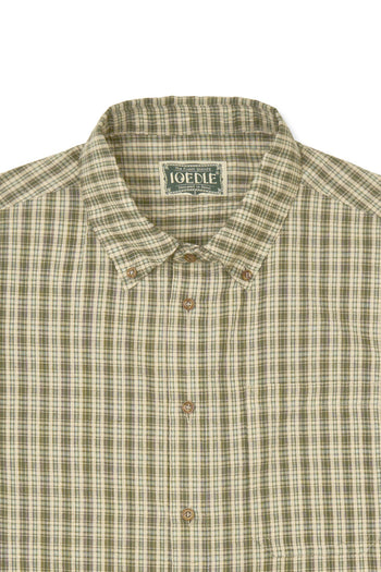 IOEDLE Rocket Slit Short-sleeve Shirt with stylish design and slit detail, displayed hanging on a wooden hanger.