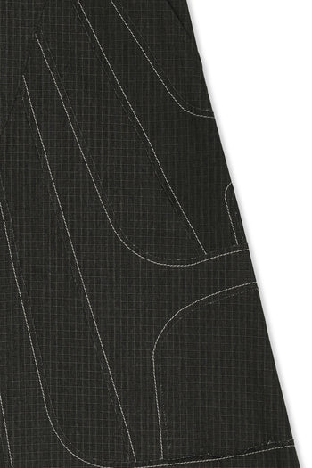 IOEDLE stitched stream skirt featuring elegant stitching details and a flowing design, showcased from a side view.