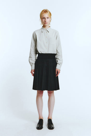 Black frill pleats skirt by LOVE CRAZY WILD MAN, showcasing ruffled details and flowy fabric.