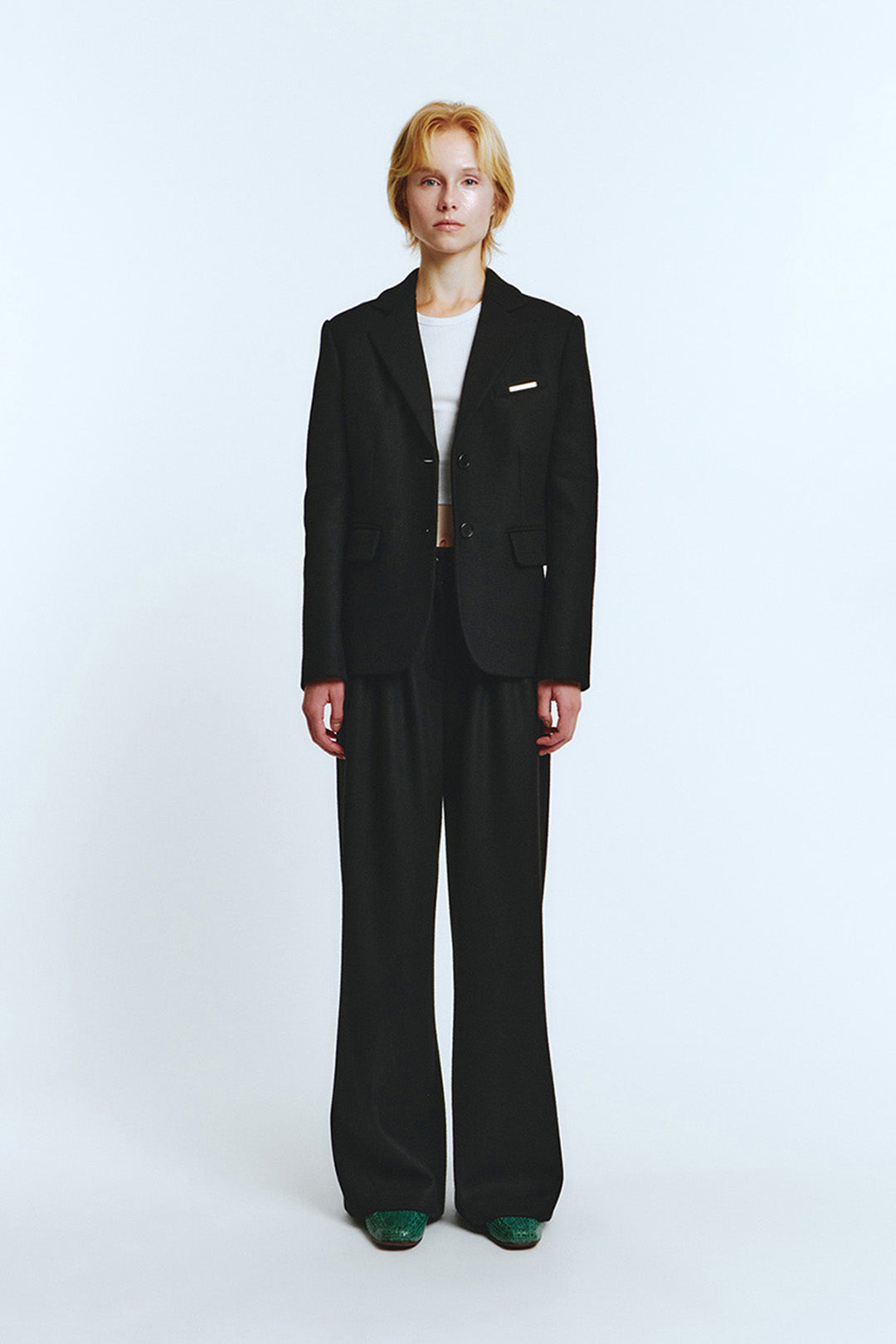 Black blazer jacket by LOVE CRAZY WILD MAN, featuring a tailored fit and classic lapel, shown on a model.