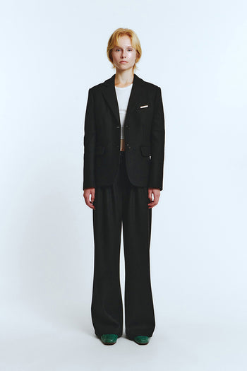 Black blazer jacket by LOVE CRAZY WILD MAN, featuring a tailored fit and classic lapel, shown on a model.