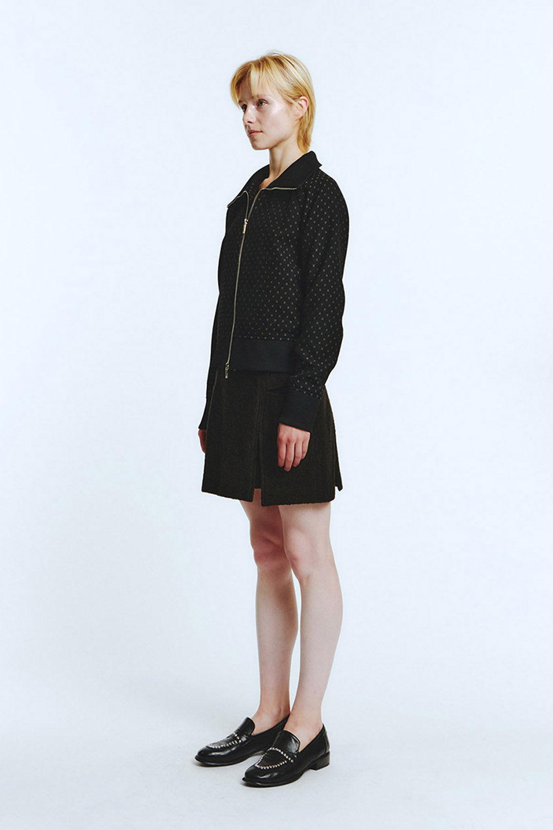 Black wool track jumper by LOVE CRAZY WILD MAN, showing a cozy, fitted jumper with ribbed cuffs and collar.