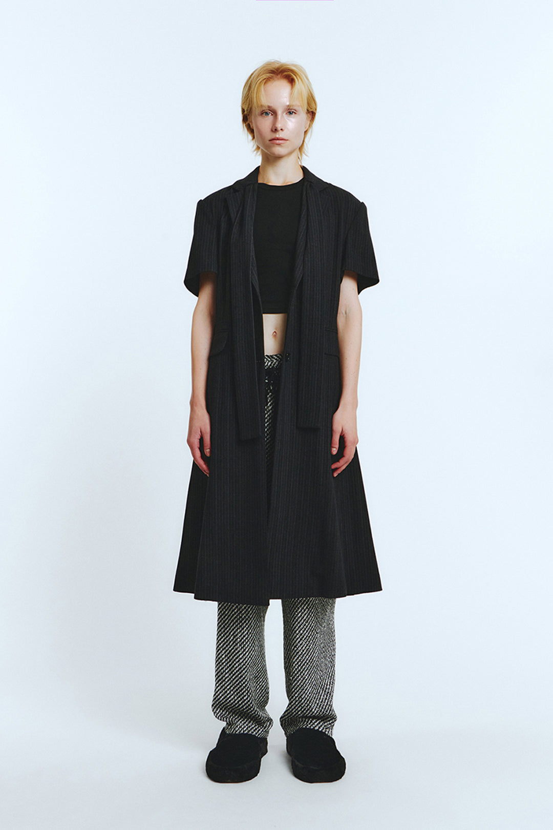 Black half-sleeve coat by LOVE CRAZY WILD MAN, featuring a stylish, tailored design perfect for versatile fashion.