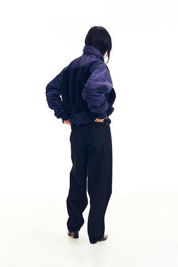 Wavy denim pants by LOVE CRAZY WILD MAN featuring a unique wavy design and casual fit, displayed on a white background.