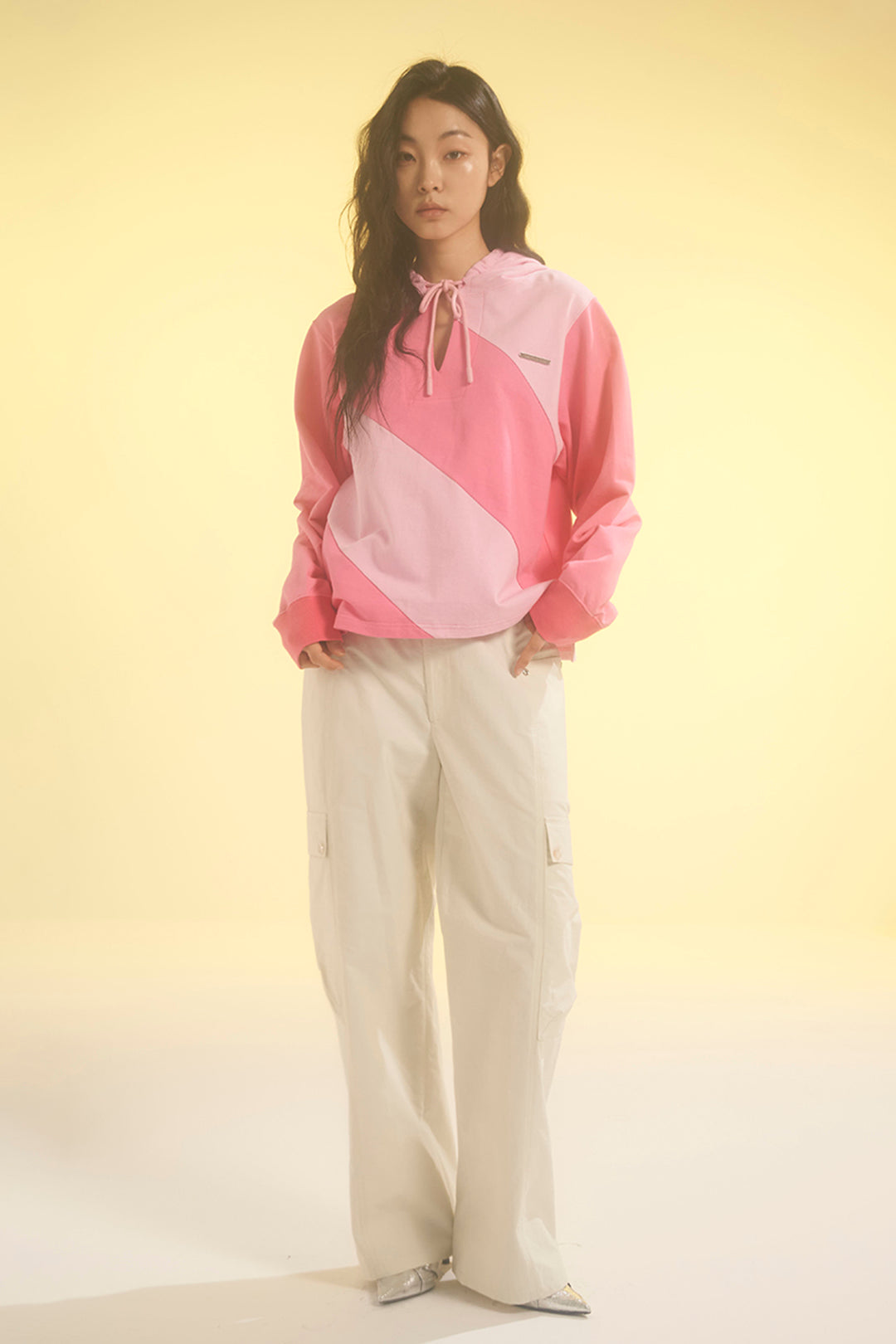 Pink LOVE CRAZY WILD MAN diagonal hoodie with bold graphic design and relaxed fit, displayed on a plain background.