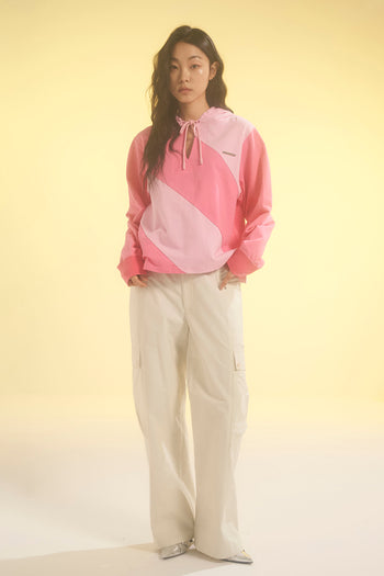 Pink LOVE CRAZY WILD MAN diagonal hoodie with bold graphic design and relaxed fit, displayed on a plain background.