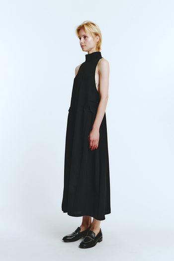 Black high neck dress by LOVE CRAZY WILD MAN, featuring a fitted silhouette and stylish neckline, shown on a model.