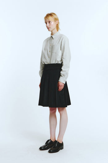 Black frill pleats skirt from LOVE CRAZY WILD MAN with a flowy, layered design and ruffled hem, shown on a mannequin.