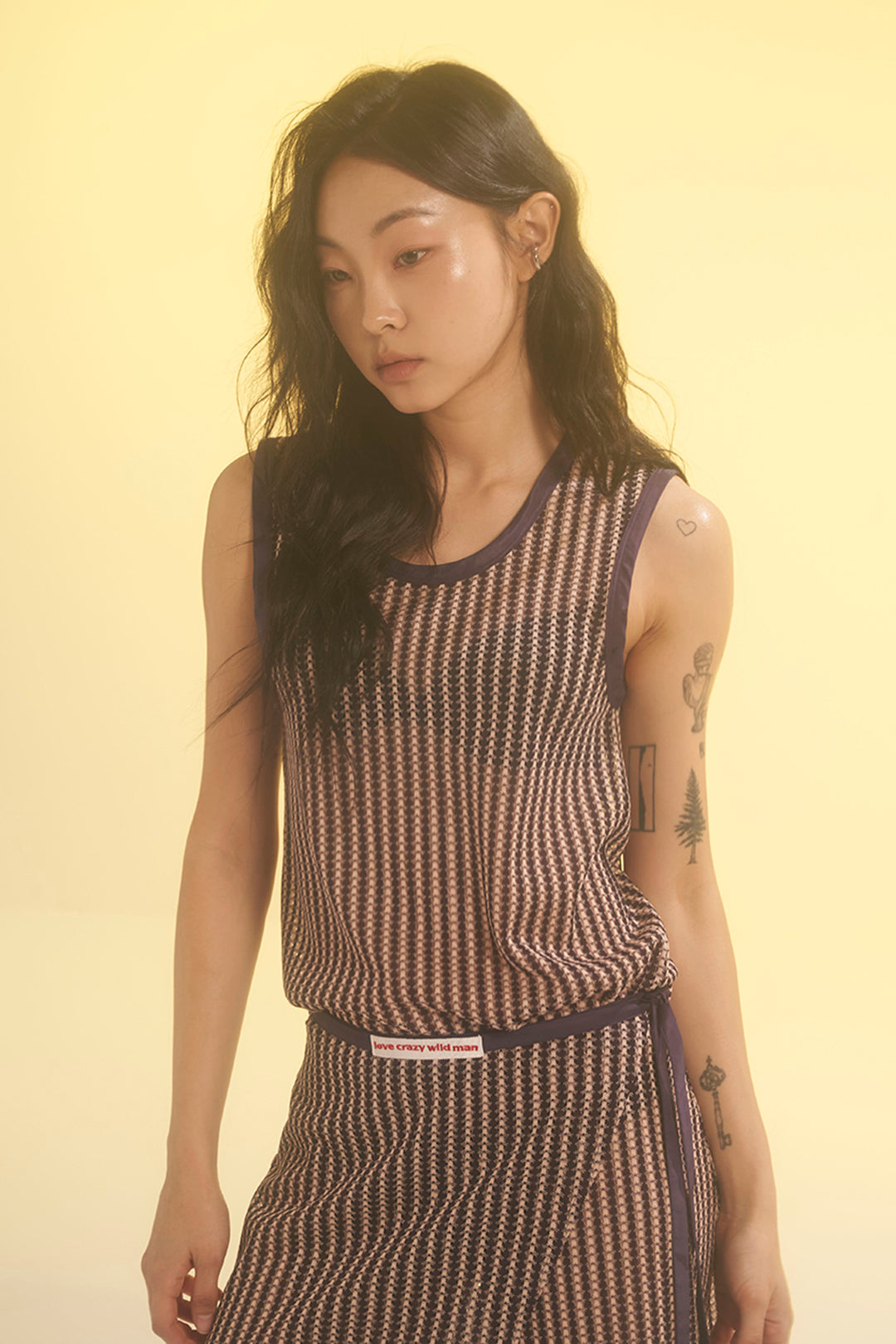 Beige striped mesh tank top from LOVE CRAZY WILD MAN, casual sleeveless top with breathable fabric and stylish design.