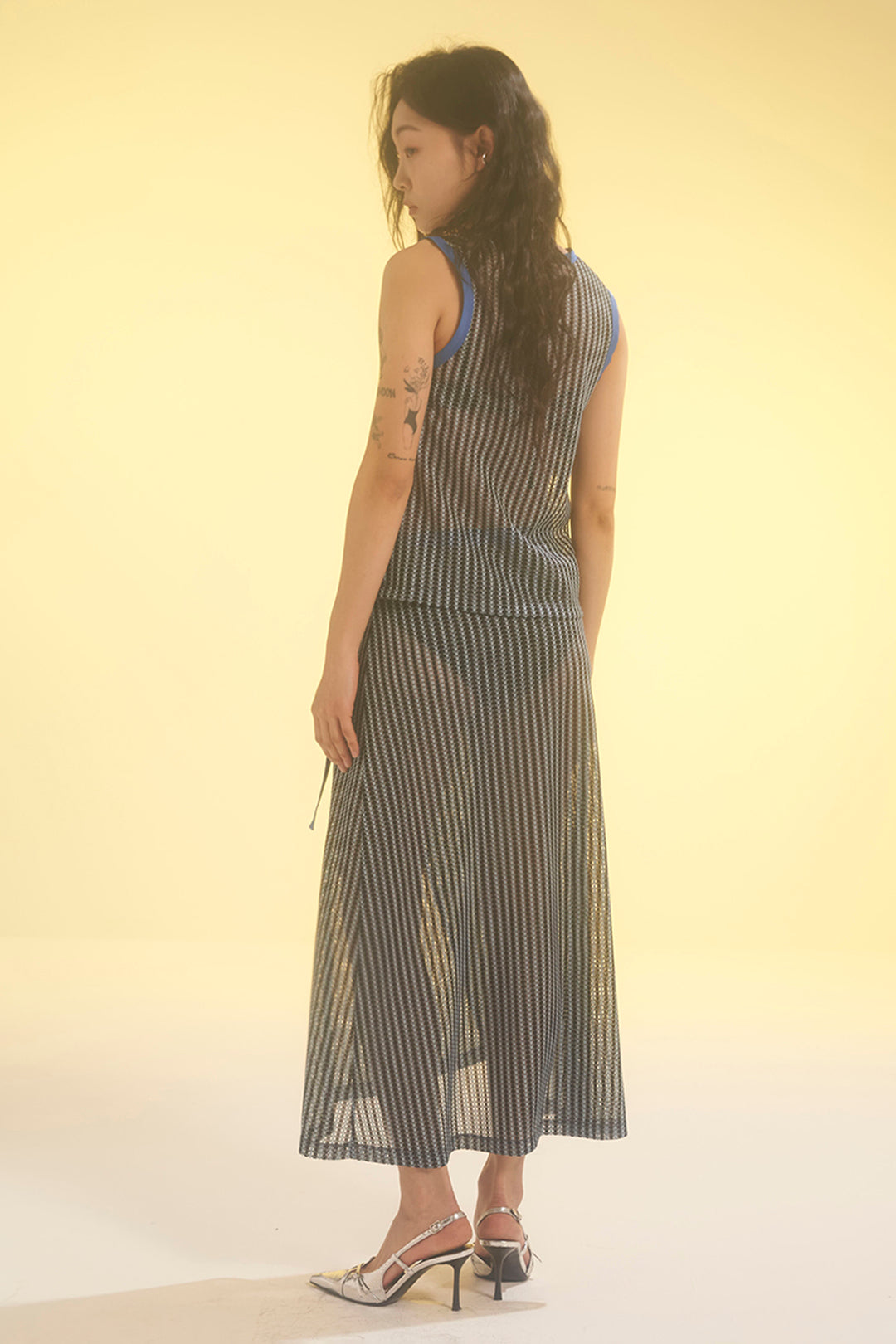 Blue striped mesh tank top by LOVE CRAZY WILD MAN, featuring lightweight breathable fabric and stylish design.