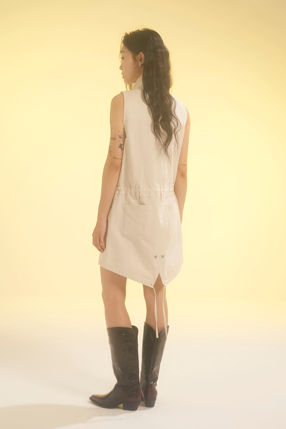 Ivory Safari Dress by LOVE CRAZY WILD MAN featuring a relaxed fit, button details, and lightweight fabric, displayed on a hanger.