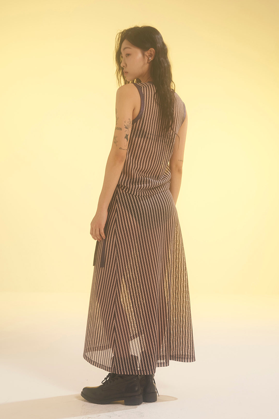 Beige striped mesh wrap skirt by LOVE CRAZY WILD MAN, featuring lightweight, breathable fabric and a stylish wrap design.