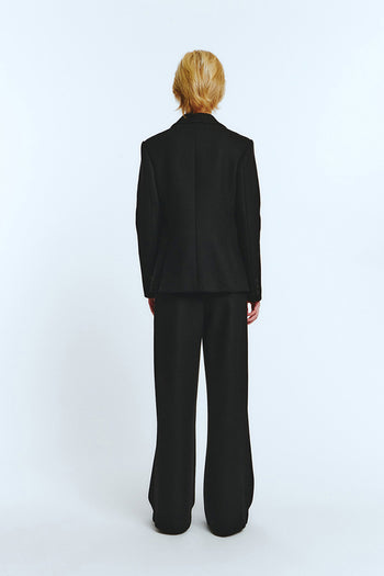 Black blazer jacket by LOVE CRAZY WILD MAN, tailored fit with lapels, shown on a hanger against a neutral background.