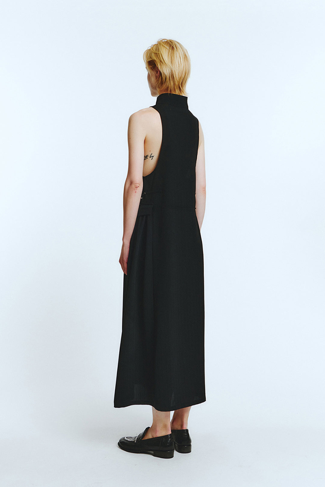 Black high neck dress by LOVE CRAZY WILD MAN, featuring a fitted silhouette and elegant design.