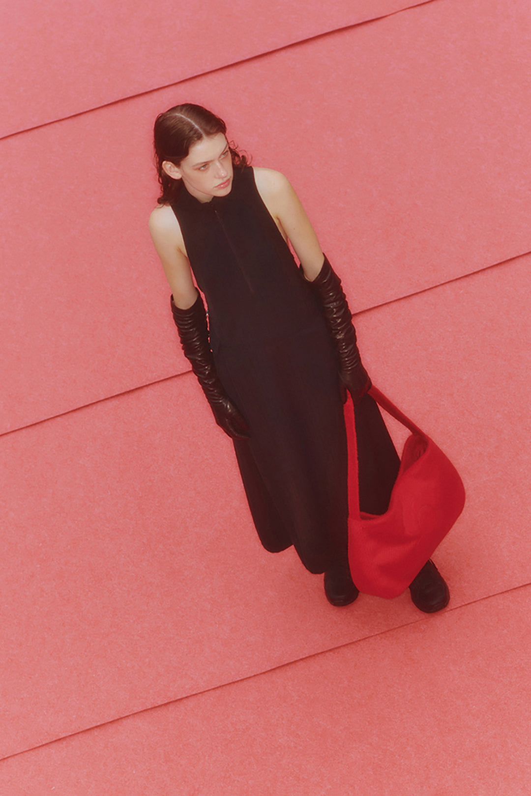 Black high neck dress by LOVE CRAZY WILD MAN, showcasing a fitted silhouette and elegant neckline in a stylish fashion image.