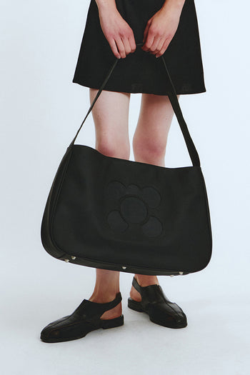 Black Packman Bag by LOVE CRAZY WILD MAN featuring a compact, stylish bag with a playful design and adjustable strap.