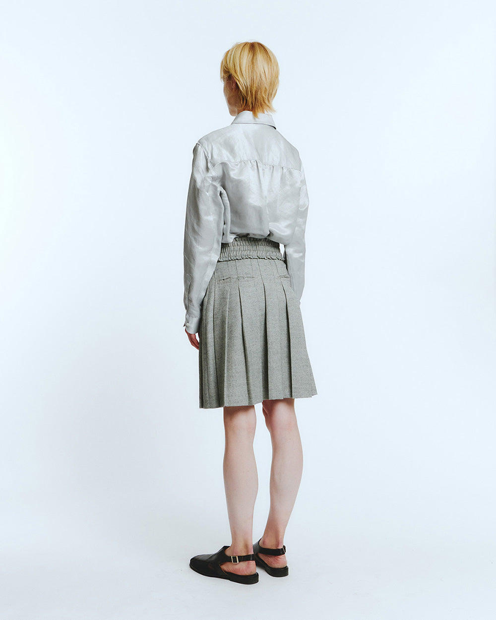LOVE CRAZY WILD MAN frill pleats skirt in melange grey fabric, showcasing flowing pleated design and stylish silhouette.