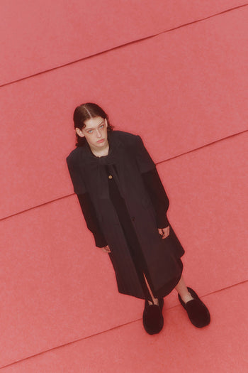 Black half sleeve coat by LOVE CRAZY WILD MAN, featuring a stylish design with a collar and button details.
