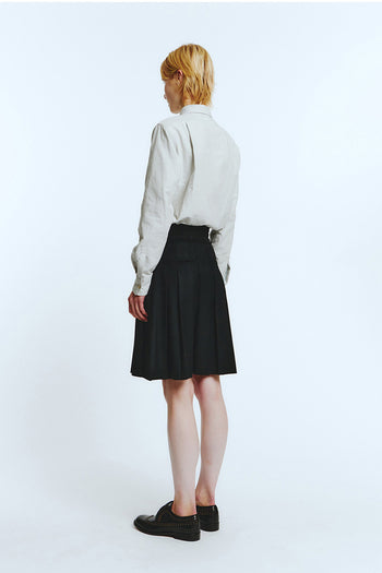 Black frill pleats skirt by LOVE CRAZY WILD MAN, showcasing flowy fabric and layered ruffle details.