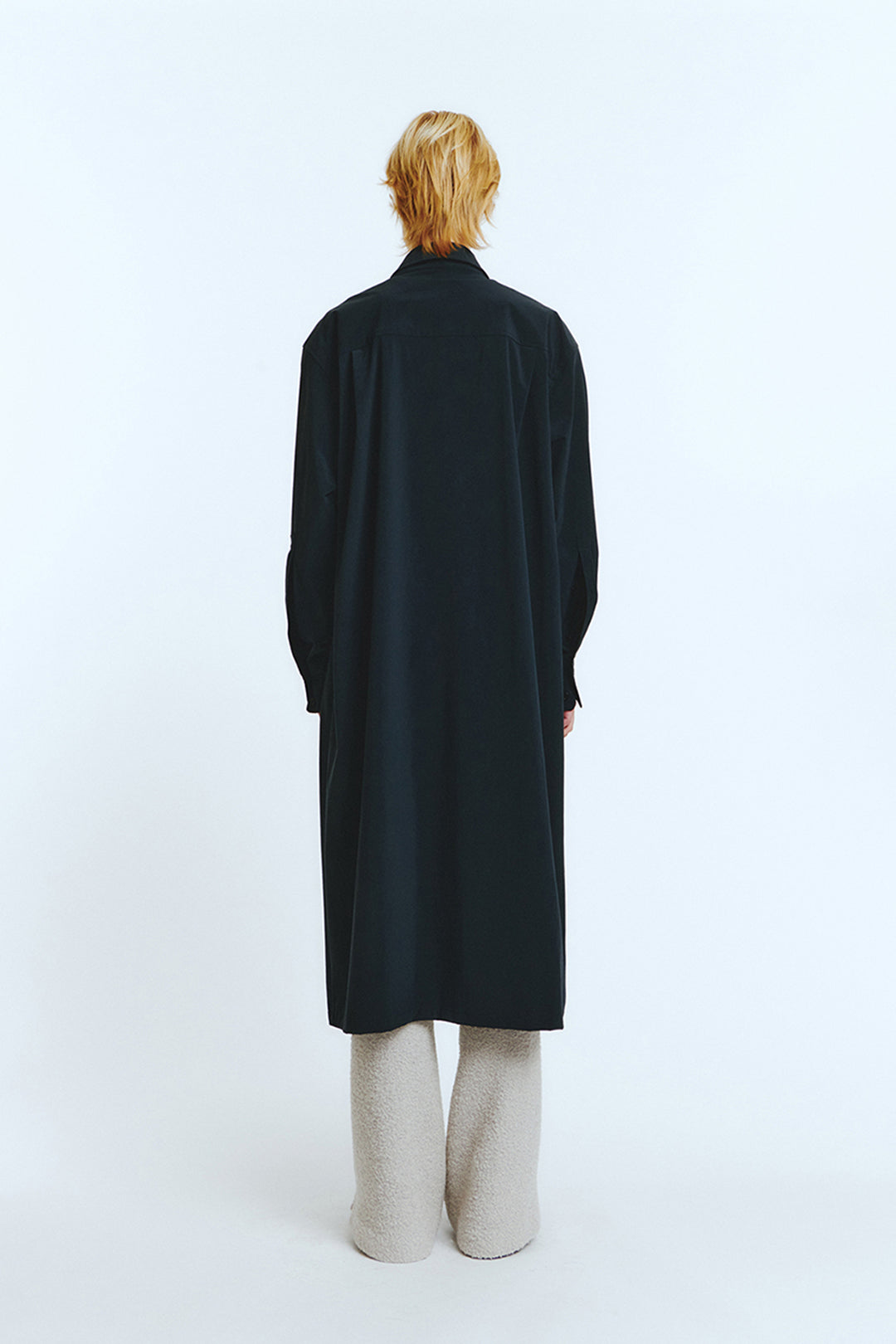 Navy long shirt jumper by LOVE CRAZY WILD MAN featuring a relaxed fit and casual style, displayed hanging on a wooden hanger.