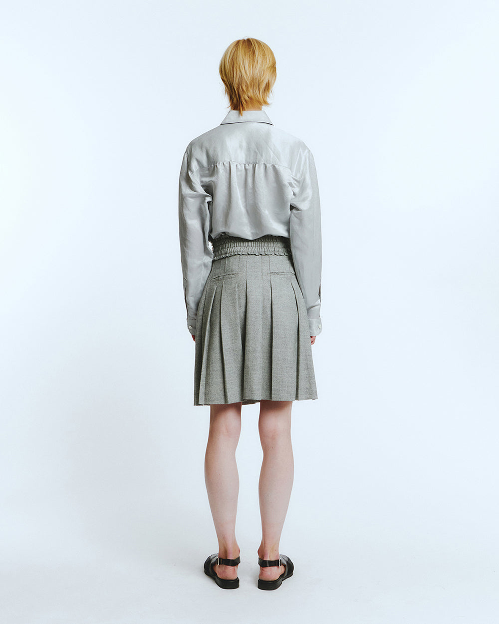 Love Crazy Wild Man frill pleats skirt in melage grey, showcasing its flowy fabric and stylish design.