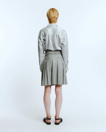 Love Crazy Wild Man frill pleats skirt in melage grey, showcasing its flowy fabric and stylish design.