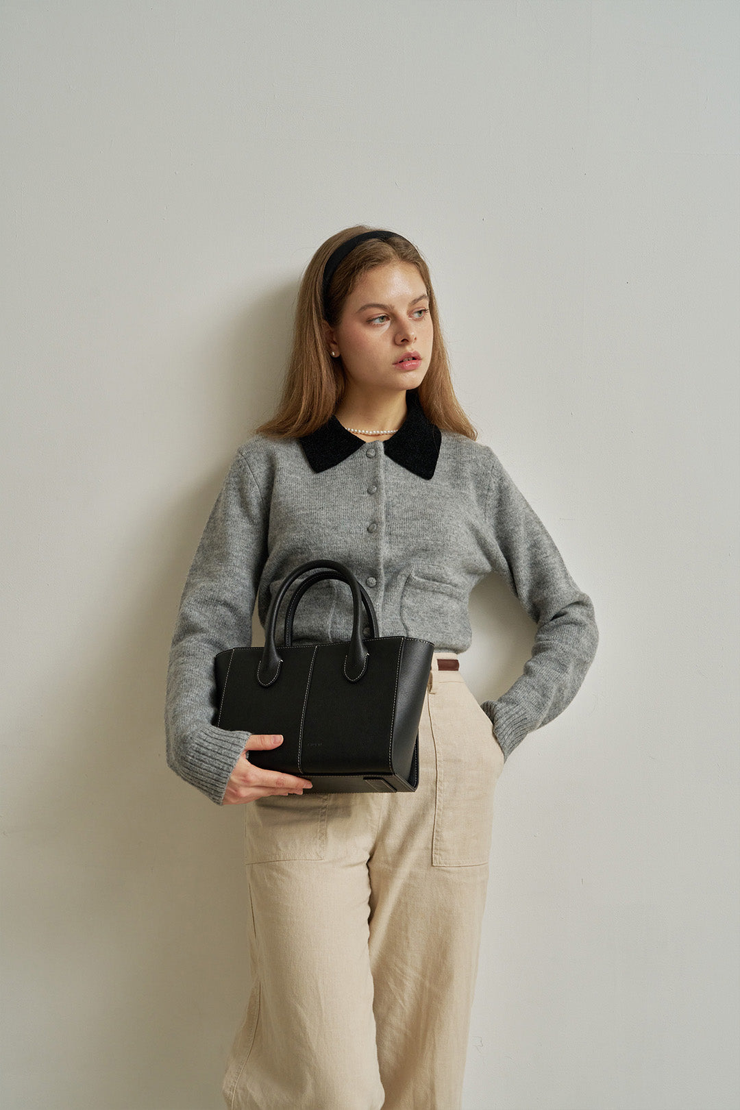 Medium MIULIN Blenged leather tote bag with sturdy handles and sleek design, shown in a natural light setting.