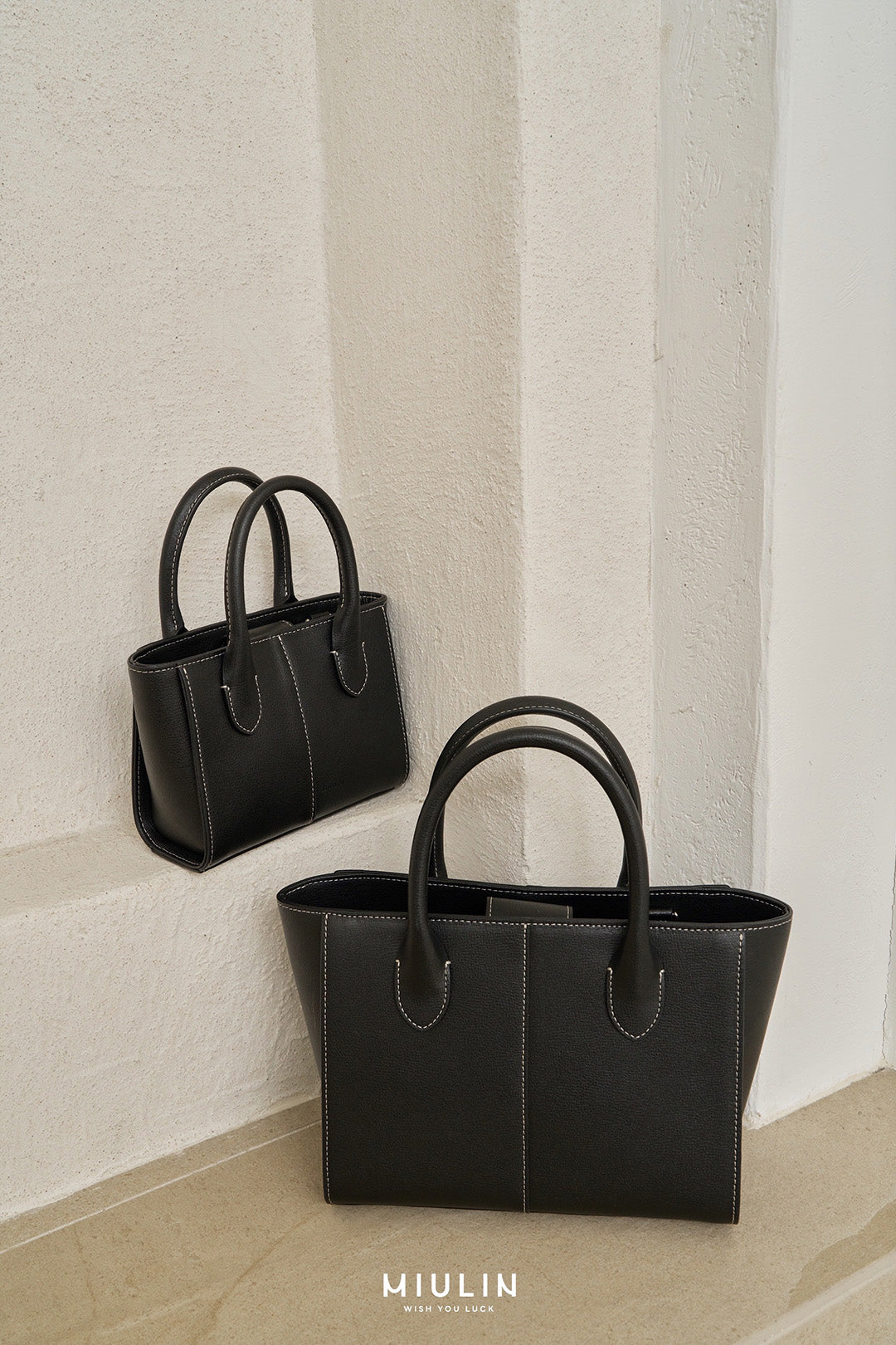 Medium Blenged leather tote bag by MIULIN with sturdy handles and sleek design, perfect for everyday use.