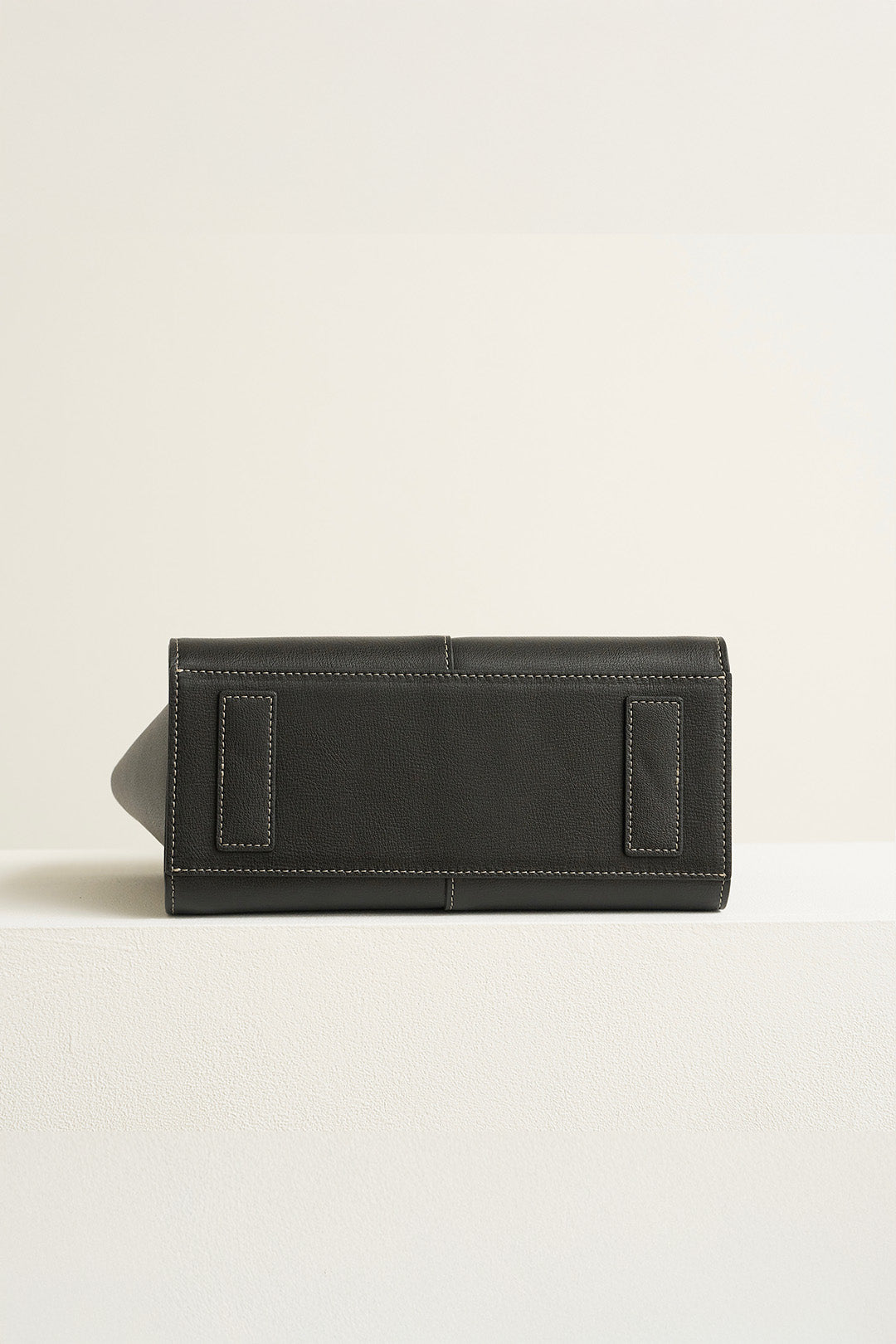 Medium Blenged leather tote bag by MIULIN, showing its sleek design and sturdy handles in a close-up view.