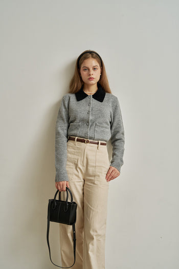 Small MIULIN Blenged leather bag showing its compact design and smooth leather texture with a top handle and subtle branding.