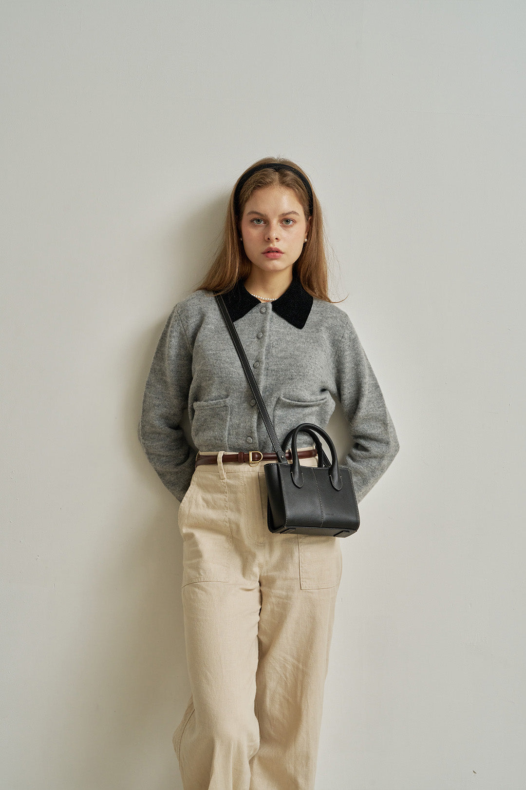 Small MIULIN Blenged leather bag with top handle and sleek design, perfect for everyday use.