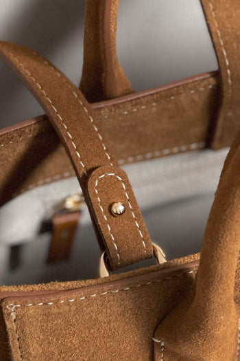Medium Brunir suede bag by MIULIN with sturdy handles and a sleek design, perfect for casual or everyday use.