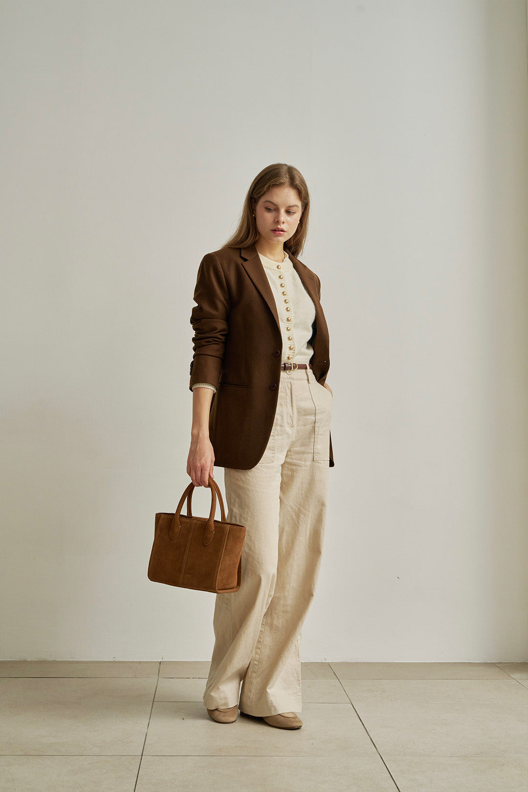 Medium Brunir suede bag by MIULIN featuring a structured tote design with top handles and soft suede texture.
