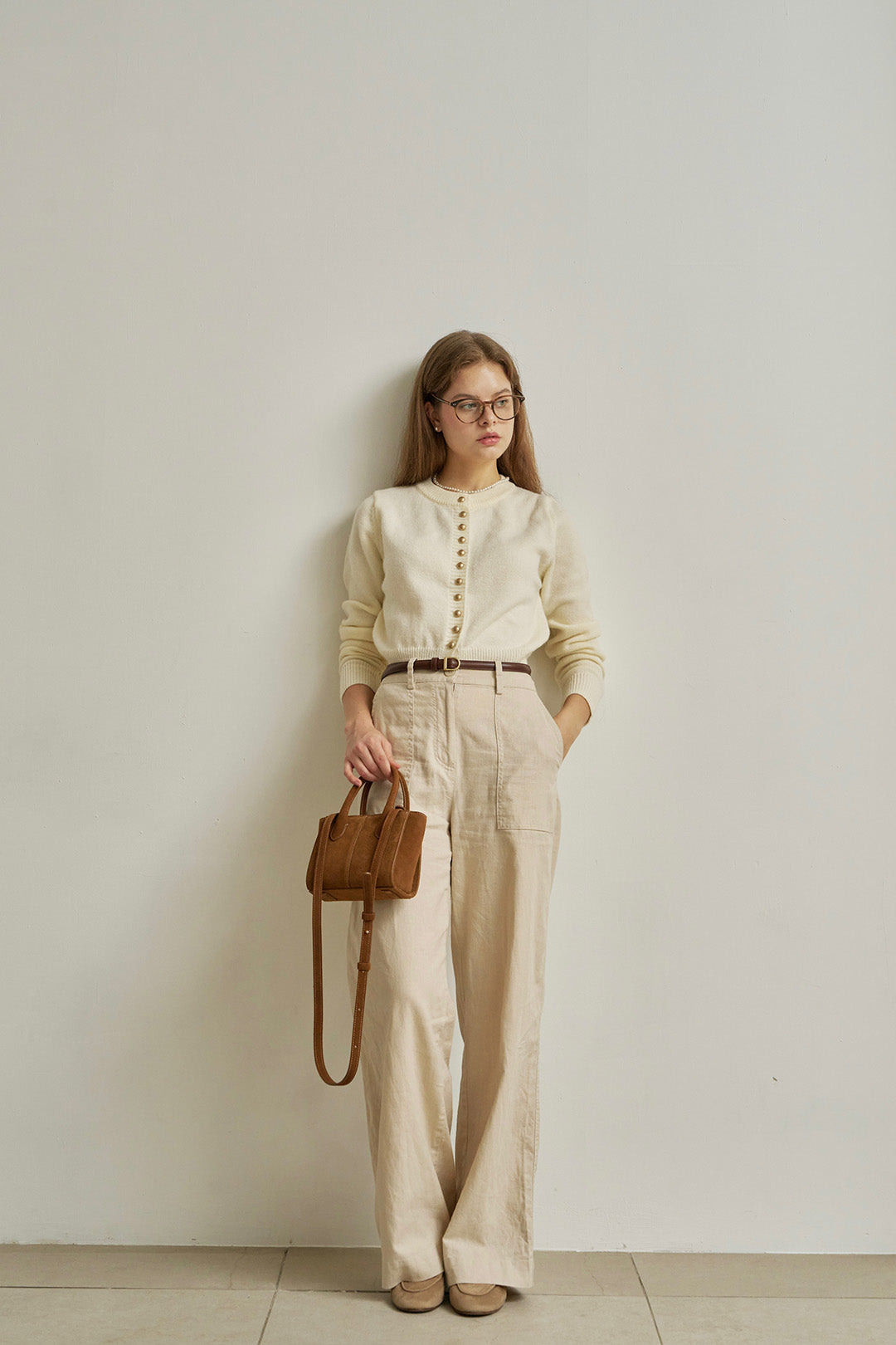 Small MIULIN Brunir suede bag with top handles and sleek design, perfect for casual or chic everyday use.