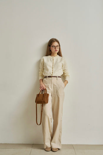 Small MIULIN Brunir suede bag with top handles and sleek design, perfect for casual or chic everyday use.