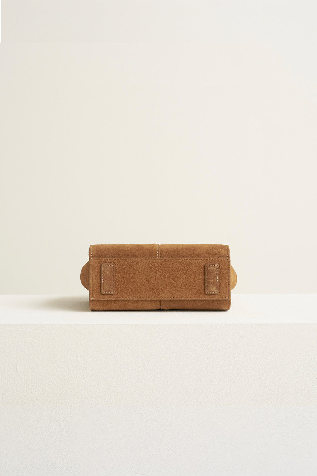 Small MIULIN Brunir suede bag with a sleek tote design and top handles, made from soft, textured suede material.